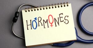 the word hormones written on notebook
